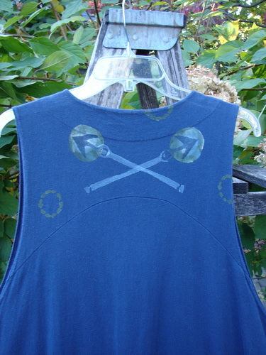 1996 State Fair Vest Directional Arrow Ridge Size 2, a dark blue sleeveless shirt, featuring a unique painted motif of crossed lines and round circles, hanging outdoors on a clear plastic hanger.