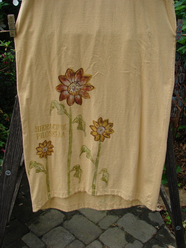 1998 Botanicals Calla Dress Tall Sunflower Sundial Dress Size 1 with a painted sunflower design, folded neckline, drop shoulders, pegged shape, and upward scooped hemline, displayed flat against a simple background.