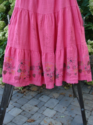 Barclay Linen Fold Over Three Tier Skirt Daisy Flamingo Size 2, featuring a frilled hem, full cotton Lycra waistband, and triple horizontal tiers for a springy look.