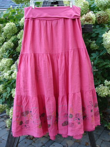 Barclay Linen Fold Over Three Tier Skirt Daisy Flamingo Size 2 displayed on a rack, showcasing triple horizontal tiers and a frayed lower batiste hem.