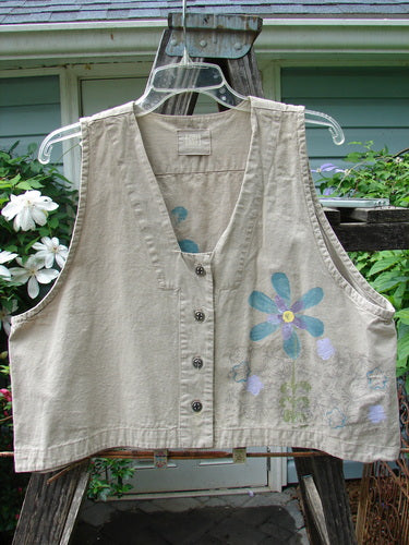 2000 Parachute Cross Stitch Vest Sunrise Floral Dove Size 0 on a hanger, featuring vibrant floral patterns, deep V neckline, four metal buttons, and deep arm openings.