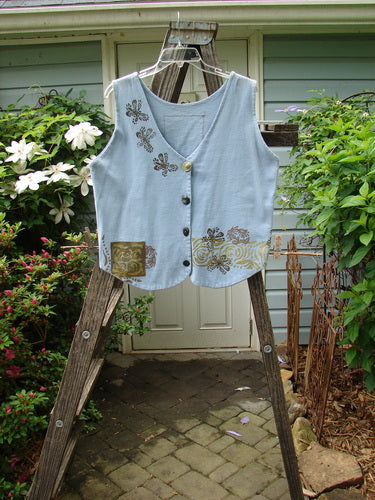 1993 The Vest Wind Garden Periwinkle Altered Size 1 on a wooden ladder, showcasing the tuxedo style front tails and cultivated garden theme paint.