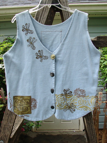 1993 The Vest Wind Garden Periwinkle Altered Size 1 features gold designs, Blue Fish buttons, tuxedo-style tails, and a heart patch, displayed against a wooden fence for Bluefishfinder.com.