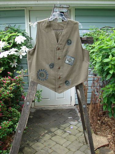 1995 Denim Invention Vest Fish Sun Bramble Altered OSFA displayed on a ladder, showcasing its light-weight denim, metal buttons, varying hemline, drawcord back, and signature blue fish patch.