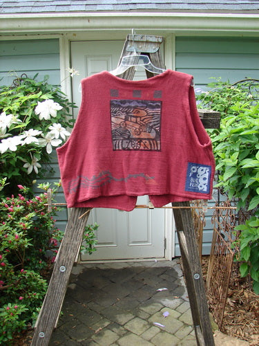1995 Reprocessed Jazz Vest Vintage Car Hollyberry Altered Size 2 displayed on a wooden ladder, showcasing its deep V neck, single button closure, and vintage car-themed paint with a blue fish patch.