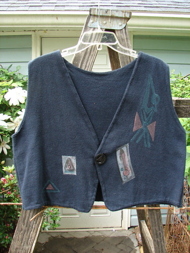 1995 Reprocessed Jazz Vest Mystery Gal Black Altered Size 2, featuring a single button closure, deep V-neck, bright blue fish patch, and contrasting hemlines with artistic paint details.