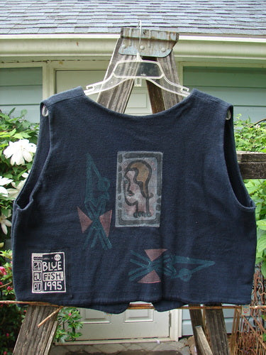 1995 Reprocessed Jazz Vest Mystery Gal Black Altered Size 2, featuring a graphic design of a woman's face, deep V neck, single button closure, and contrasting hemlines.