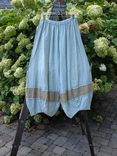 Barclay Linen Meadow Pant Twill Contrast Unpainted Sage Size 0, featuring a full elastic waist, gathered panels, and bellowing mid-lowers, displayed on a rack.