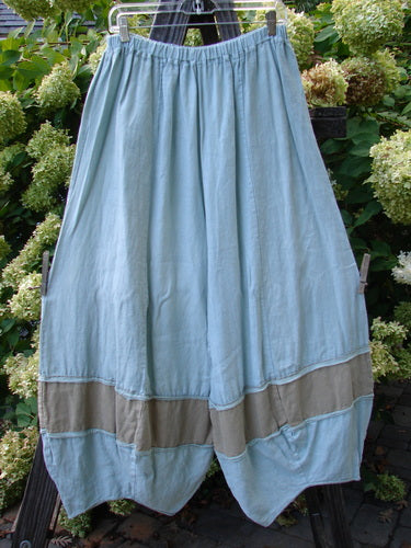 Barclay Linen Meadow Pant Twill Contrast Unpainted Sage Size 0 displayed on a hanger, featuring a full elastic waistline, gathered horizontal panels, and slightly cropped bellowing lower legs, perfect for spring or summer.