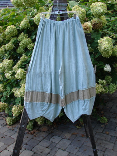 Barclay Linen Meadow Pant Twill Contrast Unpainted Sage Size 0 displayed on a rack, showcasing its full, bellowing shape with gathered horizontal panels and textured lower accents.