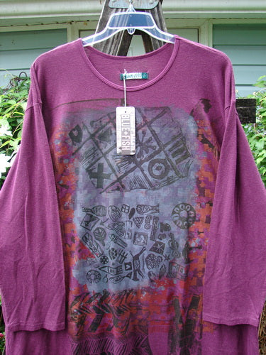 Barclay NWT Hemp Cotton Long Sleeved Studio Tee in Knick Knack Tyrian Berry, displayed on a hanger, showcasing its rounded neckline, drop shoulders, and wide sleeves.