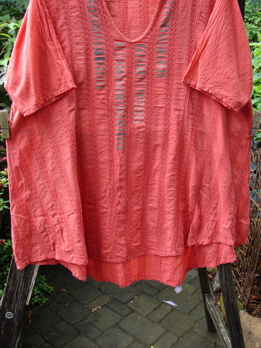 Barclay Linen Cotton Basket Weave Draw Back Tunic Unpainted Sherbert Size 2, displayed on a clothes rack, highlighting its short sleeves and intricate textile pattern.