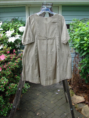 Barclay Batiste Bliss Dress, Fallen Petal Stonetail Size 0, features a softly rounded neckline, short sleeves, and two exterior flop pockets, embodying Blue Fish Clothing's creative freedom ethos.