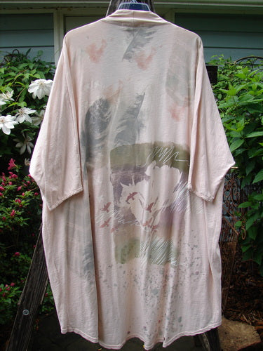 Barclay NWT Art Kimono Wind Dust Hush Pink Slub OSFA displayed on a hanger, featuring dolman sleeves and delicate design details.