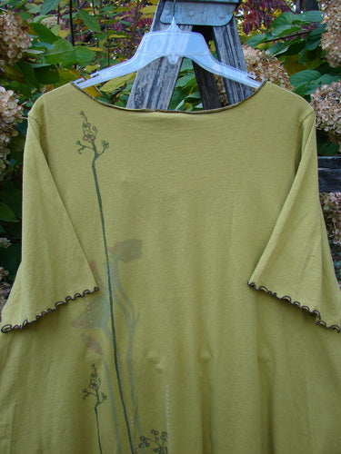 Barclay Gather Twinkle Top Berry Rise Yellow Olive Size 2 displayed on a hanger, featuring elbow-length sleeves with scalloped edges and a botanical print, styled with a rounded A-line shape.
