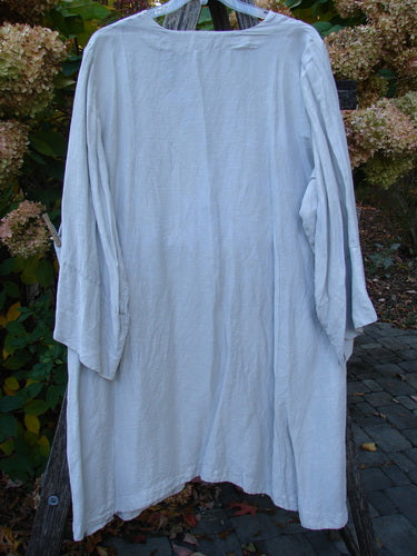 Barclay Hemp Silk Single Button Cardigan Unpainted Dew Size 2, a lightweight garment with long sleeves, deep V neckline, and single shell button closure, displayed on a hanger outdoors.