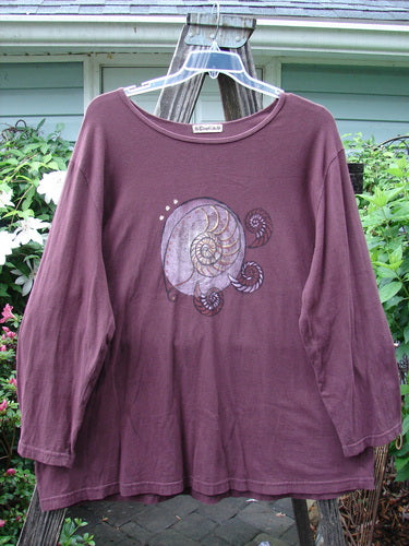 Barclay Long Sleeved Tee Spin Shell Deep Burgundy Size 3, showcasing a centered spiral design, wide boat neckline, swinging A-line shape, and long sleeves, made from mid-weight organic cotton.