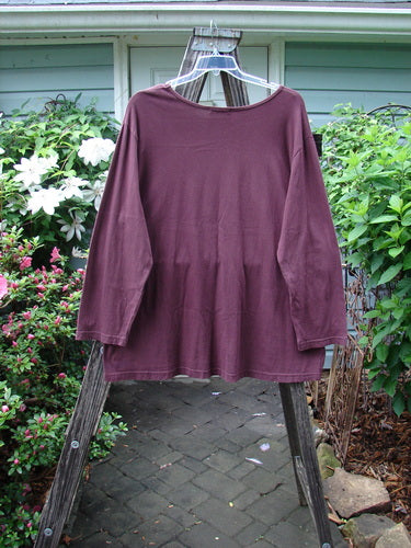 Barclay Long Sleeved Tee Spin Shell Deep Burgundy Size 3 displayed on a clothes hanger, showcasing its A-line shape and long sleeves.