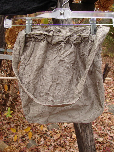 Crinkled-look tote bag in cement from the 2000 NWT Shaunting Silk Bags collection, featuring a ruffled top and long handles, hanging outdoors against an autumn backdrop.