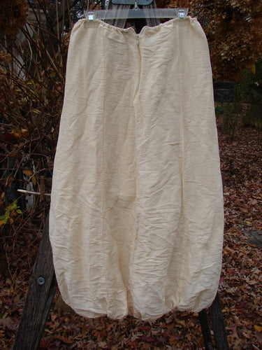 2000 Hemp Silk Reverse Skirt Unpainted Parchment Size 1, displayed outdoors, features loose-fitting pantaloons with elastic waist, gathered cuffs, and sectional seams, showcasing Bluefishfinder.com's vintage-inspired, creative style.