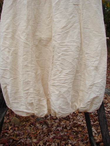 2000 Hemp Silk Reverse Skirt Unpainted Parchment Size 1 displayed outdoors, showcasing its elegant drape, elasticized bubble hem, and slightly shimmery double-layered hemp silk texture, perfect for creative expression.