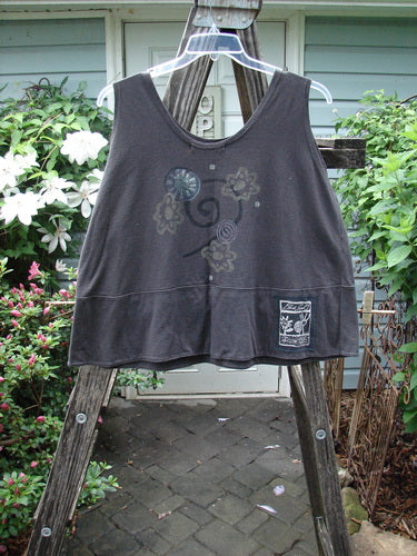 1995 Klee Top Flower Power Shadow Altered Size 2 displayed on a wooden ladder, showcasing its swingy A-line crop shape and scooped neckline with a hand-stamped ceramic button pocket closure.