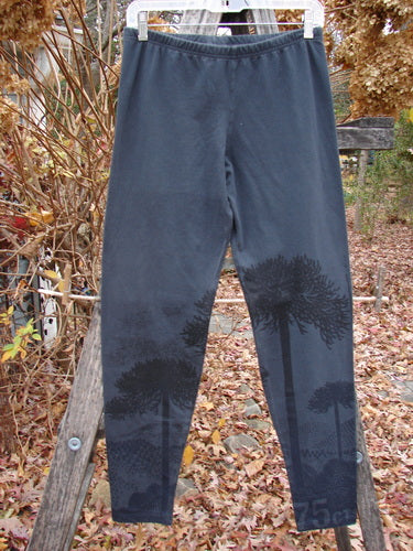 Barclay Cotton Lycra Straight Pant Shadow Tree Lux Silhouette Size 1, featuring a subtle tree print on the lower calves, displayed on a hanger against a late-autumn outdoor setting.