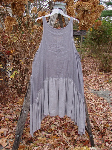 Barclay Gauze Silk Summer Frock Jumper in Unpainted Grey Haze, Size 1, features a sleeveless, loose-fitting design with a scooped neckline, asymmetrical silk lower flounce, and exterior wrap pockets.
