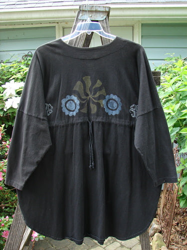 1997 Masquerade Top Celtic Continuum Obsidian OSFA featuring a teardrop neckline with button closure, flower design, drop shoulder seams, rounded hemline, vented sides, and drawcord back.