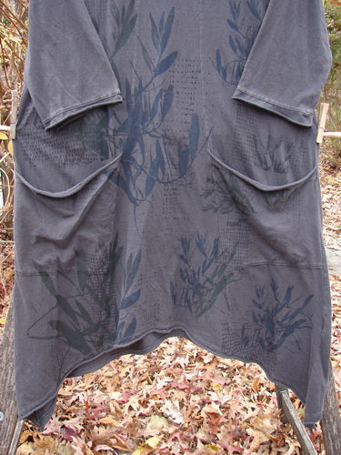 Barclay Sunny Day Pocket Tunic Dress Flutter Bamboo Steel Meteorite Size 1 features an asymmetrical hemline, tonal botanical print, and front patch pockets, hanging outdoors above fallen leaves, embodying Bluefishfinder.com's vintage charm.