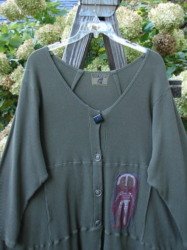 Barclay Patched Thermal Touring Cardigan Lucky Guy Pond Green OSFA displayed on a hanger, featuring a deep V-neck with vintage buttons, drop shoulders, and a kangaroo-style front pocket.