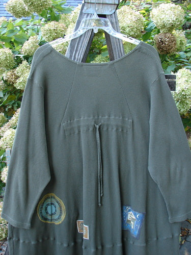 Barclay Patched Thermal Touring Cardigan Lucky Guy Pond Green OSFA displayed on a hanger, highlighting its unique flared hem, deep V-neck, vintage buttons, and kangaroo pocket.