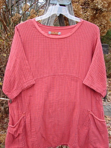 Barclay Gauze Two Pocket Urchin Dress Unpainted Geranium Stripe Size 1, featuring a loose-fitting design with a subtle grid texture, round neckline, elbow-length sleeves, and two hip-level pockets.
