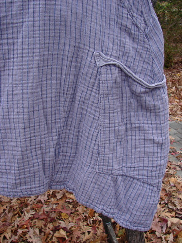 Barclay Gauze Two Pocket Urchin Dress Unpainted Light Plum Stripe Size 1, features crinkled fabric, grid pattern, flutter neckline, three-quarter sleeves, lower wrap pockets, subtle ruffle hem, and sectional panels.