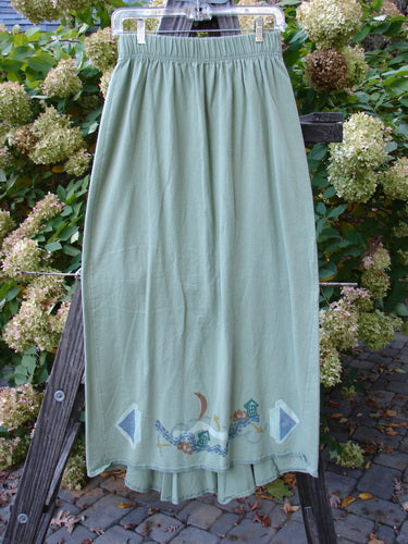 1995 Kick Pleat Skirt Road Less Traveled Spanish Moss Size 1: A skirt on a rack, close-up of a skirt, wood ladder, towel, and plant.