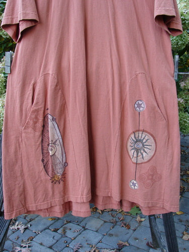 Close-up of the 1998 4 Elements Tress Dress Starburst Arausio Size 2, showcasing the A-line shape, side entry pockets, and signature Blue Fish patch.