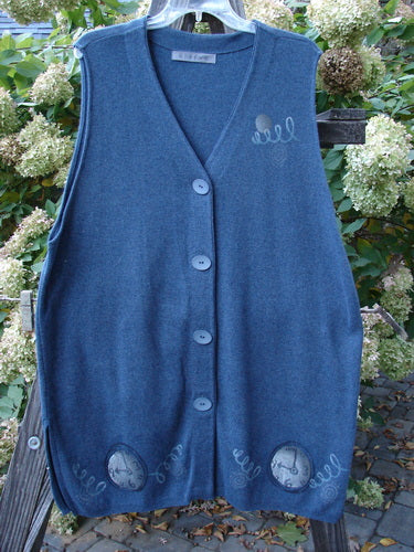 1997 Cashmere Archway Vest with pocket watch theme buttons. Deep V neckline, ribbed hemline, and sweet side vents. Dense, durable, and flowing fabric.