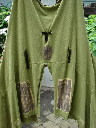 1993 Holy Vest Mythical Door Olive Size 2 featuring holes, velvet ribbon accents, sectional panels, and a varying hemline.