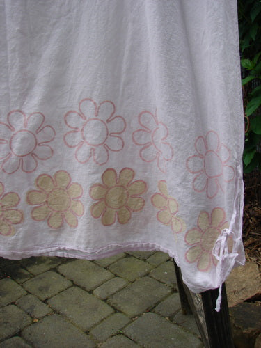 Barclay Batiste Round Neck Tie Up Shift Daisy Power Pink Cloud Size 2, featuring pink floral patterns on white cotton batiste with a rounded neckline, side gathers, and vertical center seams.