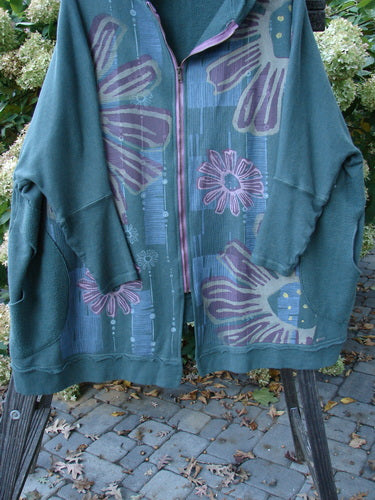 Barclay Fleece Hooded Zip Jacket Giant Daisy Pond Moss OSFA with Celtic Moss pocket accents, metallic daisy design, full zipper, cozy hood, and exterior whip stitching.