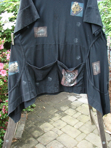 Barclay Double Pocket Bounce Tunic Dress Cat & Mouse Black Size 2, featuring a cartoon dog design, oversized pockets, and unique exterior seams.