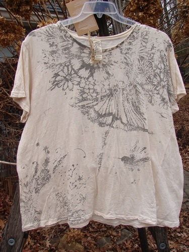 Magnolia Pearl NWT Cotton Jersey Boyfriend Tee Always & Always Moonlight OSFA features a gray floral pattern on a light-beige tee, showcasing Monet's theme. Distressed shoulder details and rolled edges enhance its artistic appeal.