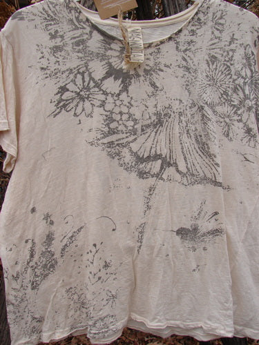 Magnolia Pearl NWT Cotton Jersey Boyfriend Tee Always & Always Moonlight OSFA features a faded gray floral print, rolled edges, and distressed shoulders, showcasing a vintage-inspired, artistic design.