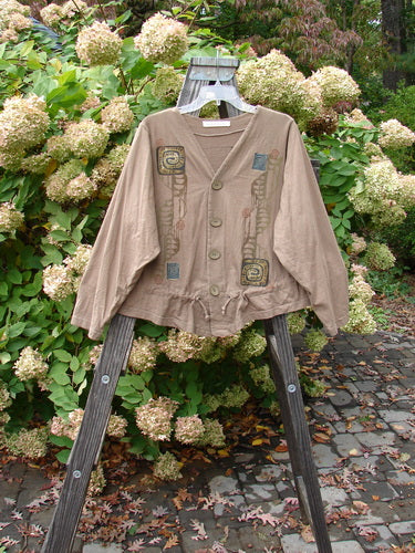 1997 Treehouse Jacket Primitive Climb Lumber Size 1 displayed on a wooden stand with a double-paneled V-neck, button line, drawcord flounce, varying hemline, and signature Blue Fish patch.