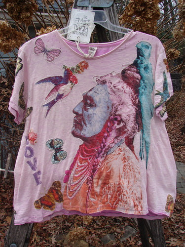 Magnolia Pearl NWT Applique Cotton Jersey Boyfriend Tee Love Is The Only Way Allium OSFA features a vibrant collage of an Indigenous elder, colorful birds, butterflies, and LOVE text, enhancing its bohemian style.
