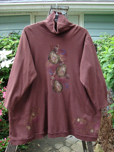 Barclay Interlock Turtleneck Pullover Tunic Top Celtic Paisley Sepia Size 2, featuring a ribbed turtleneck, A-line shape, side pockets, and Celtic paisley design on cozy, double-layered fleece fabric.