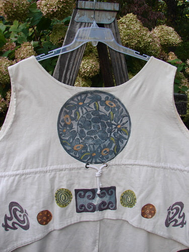 1993 The Vest Medallion Tea Dye Size 2: A white vest with blue and yellow flower design, featuring original Blue Fish buttons, tuxedo-style front tails, rounded rear hem, draw-corded back, and festive medallion theme.