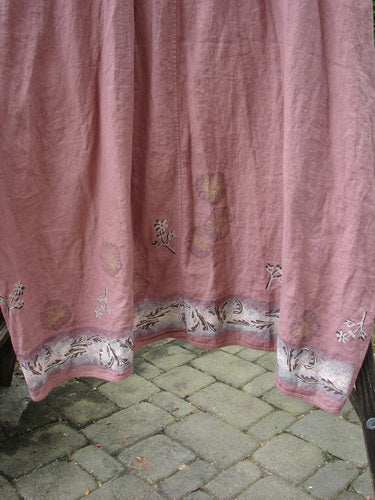 Barclay Linen Cotton Sleeve Banded Hem Pleat Dress Bird Gal Dusty Mauve Size 2 displayed with floral-design pink curtain backdrop, emphasizing pleats, oval neckline, and three-quarter sleeves.
