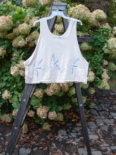 1999 Pinwheel Vest Love Dove Dust Size 2 displayed on a wooden stand, featuring bird designs, three porcelain buttons, deeper arm openings, slightly flared hemline, and wider cropped length in perfect condition.