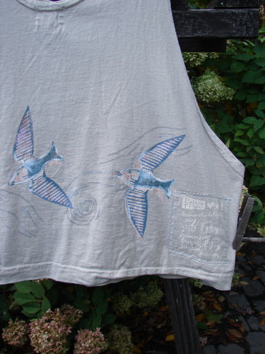 1999 Pinwheel Vest Love Dove Dust Size 2 with bird-themed paint, featuring three porcelain buttons and a slightly flared hemline, crafted from organic cotton.